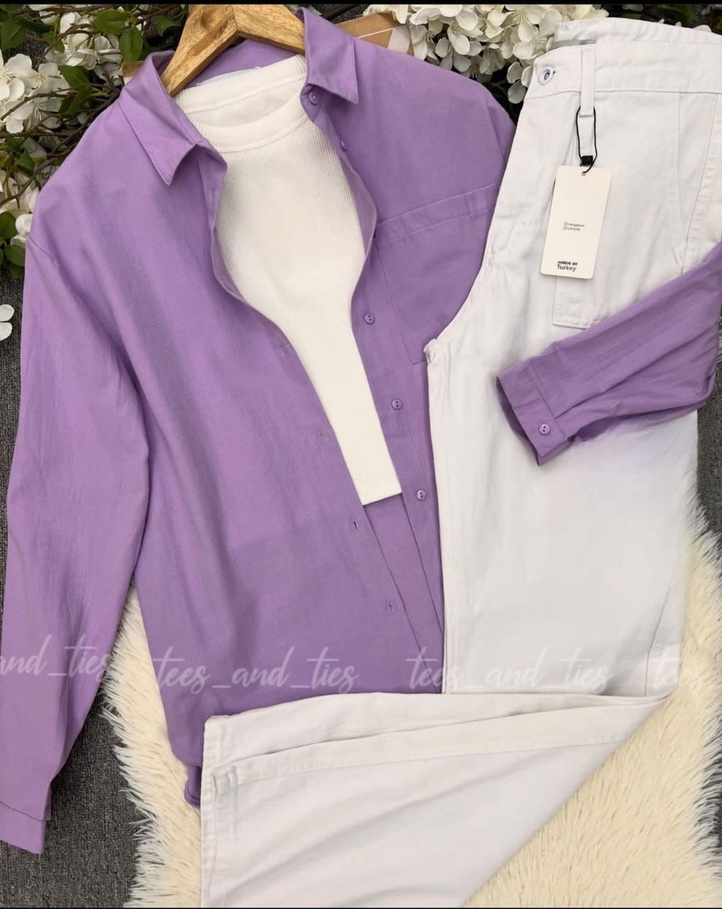 Lilac button down with white inner camisole and white wide leg jeans