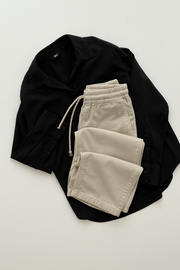 Black button down with beige flapper trouser