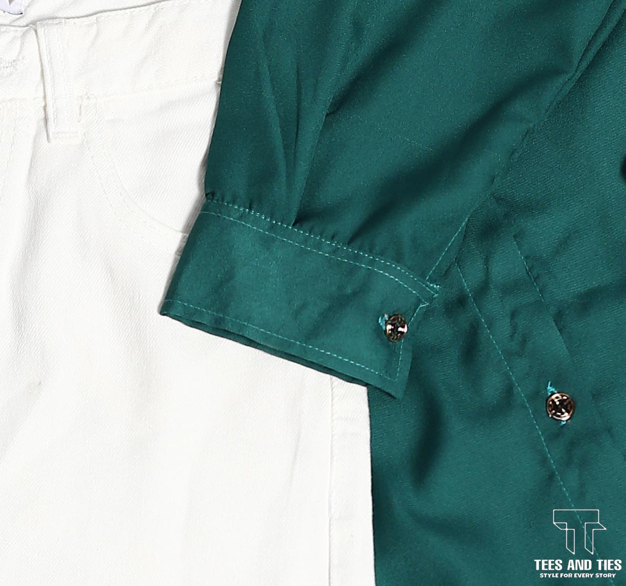 Green button down with white inner camisole and white wide leg jeans