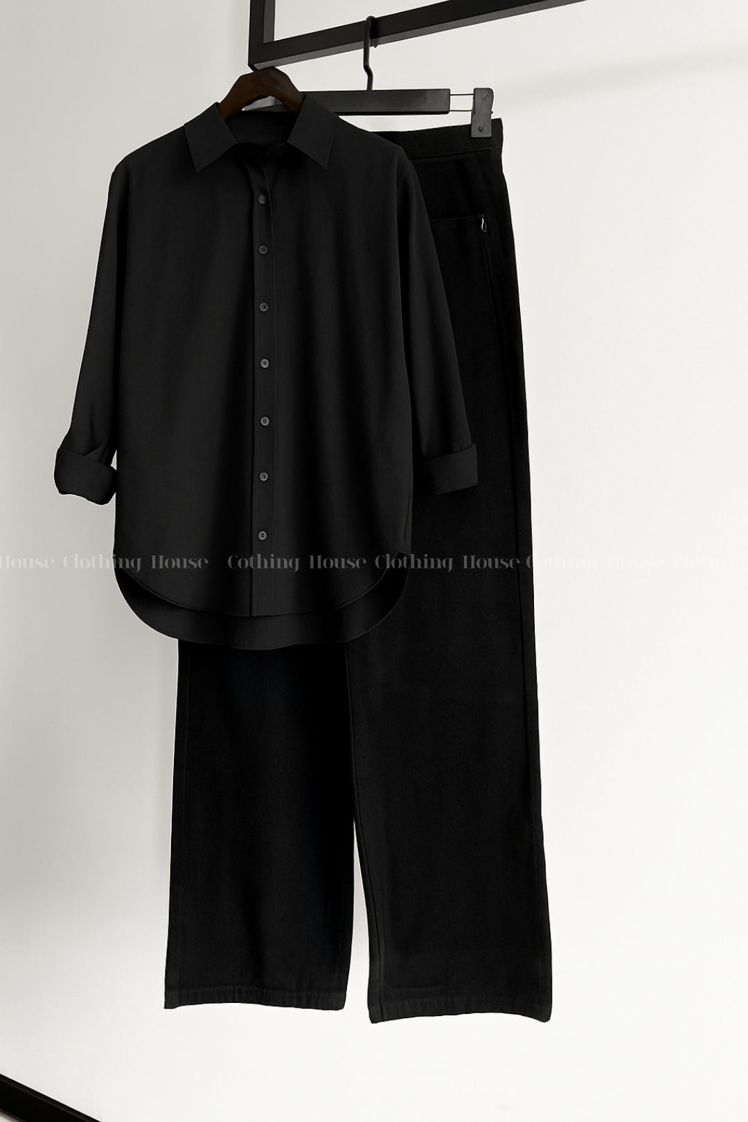 Black button down shirt with black wide leg jeans