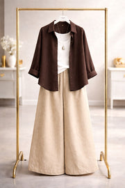 Brown button down with beige flapper trouser and white camisole