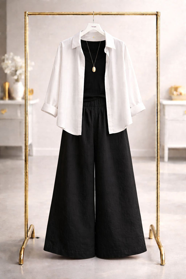 White button down with black flapper trouser and black camisole