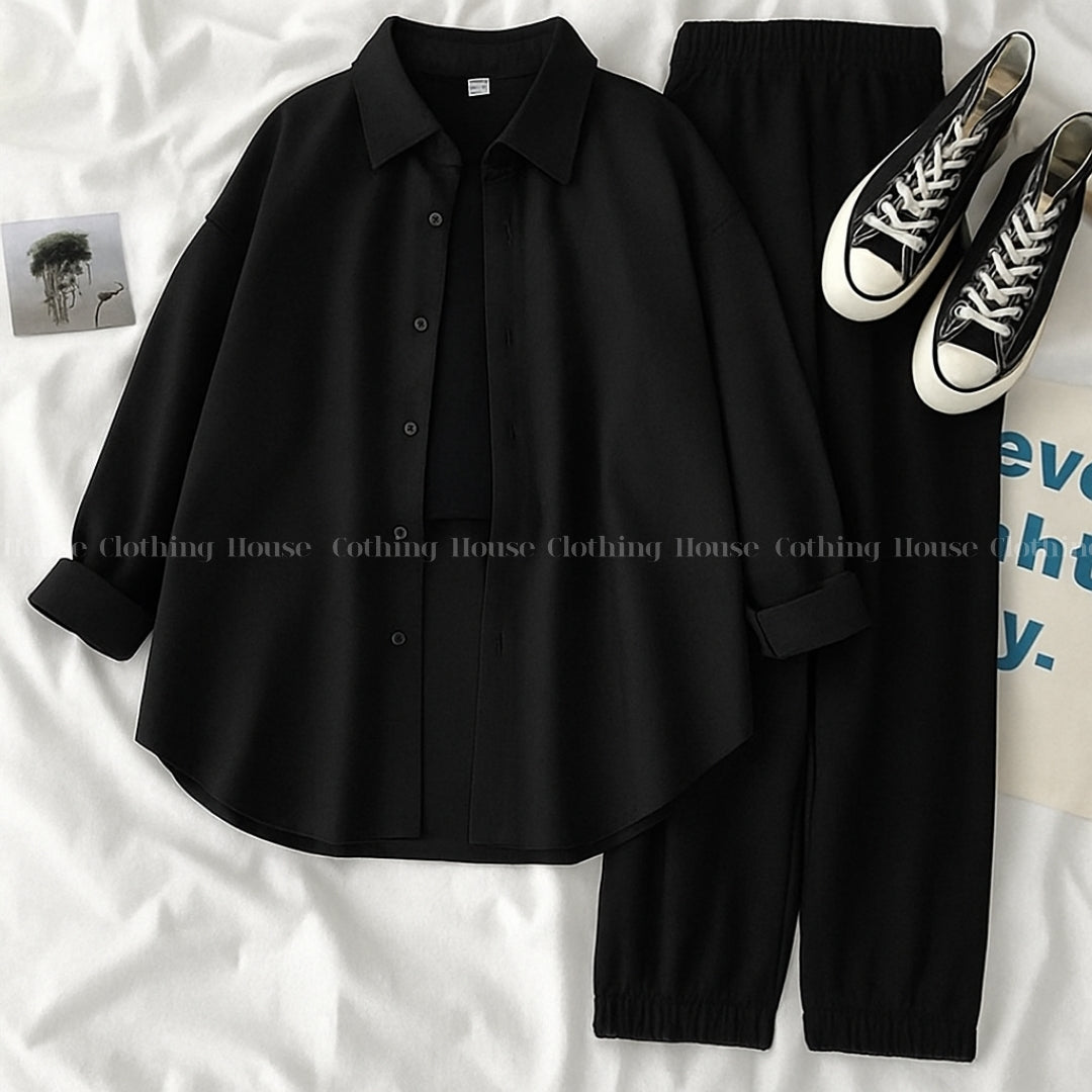 Black button down shirt with black trouser and black camisole