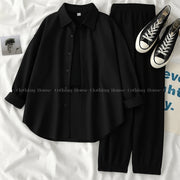Black button down shirt with black trouser and black camisole